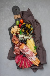 Appetizer, assortment, set, sausage, and cheese, on a wooden board, top view, no people