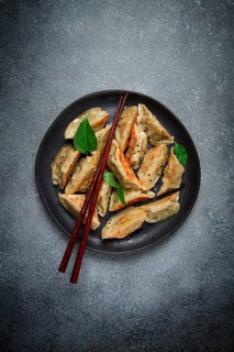 Japanese fried dumplings, gyoza, sesame seeds, top view, no people