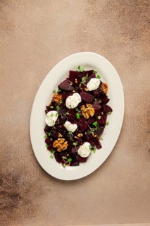 Beetroot salad with nuts, cream cheese and micro greenery, homemade, no people