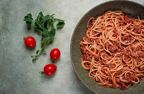 Spaghetti bolognese, in a frying pan, top view, homemade, no people