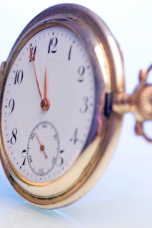 An old pocket watch shows five to twelve, Studio