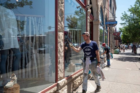 Steamboat Springs, Colorado, Men wash windows at downtown stores