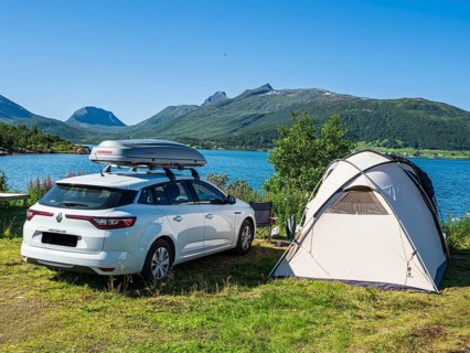 Stønnesbotn fjord, view from Fjordbotn campsite to mountain range, tourists camp in larger family