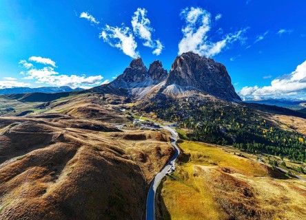 The peaks of the Sassolungo Group, Passo Sella, drone shot, Val Gardena, Dolomites, Autonomous