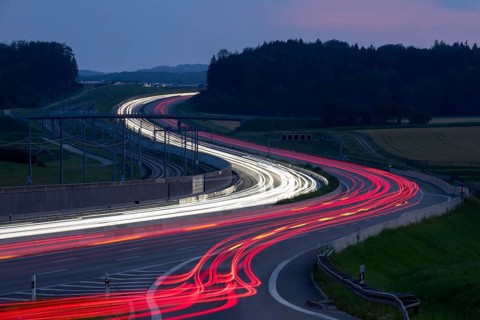 Tracers on the A8 motorway, winding road, evening, long exposure, Swabian Alb, Baden-Württemberg,