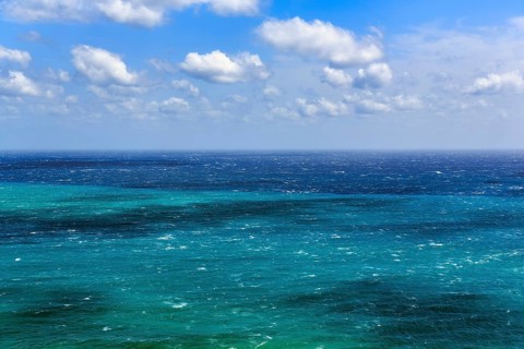 View of turquoise sea, horizon, coastline at La Isleta, sunny weather, typical light mood,