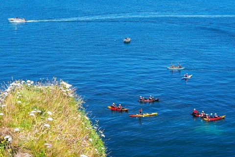 People on kayaks, White Cliffs. Old Harry Rocks Jurassic Coast, Dorset Coast, Poole, England,