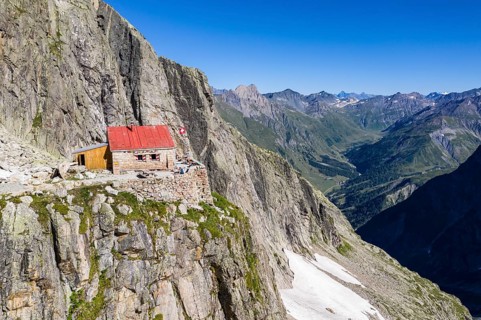 Aerial view of mountain hut Cabane de l'A Neuve, located on a steep rock formation, near La Fouly,