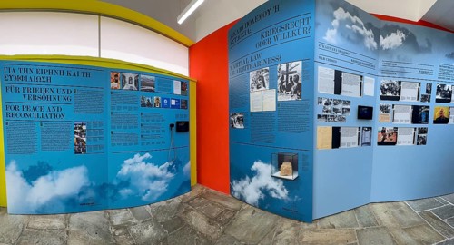 Part of exhibition in memorial site with display boards texts historical photos on history of