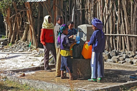Europia district, children fetching water at the well, in Debre Lebanon, Ethiopia, Africa