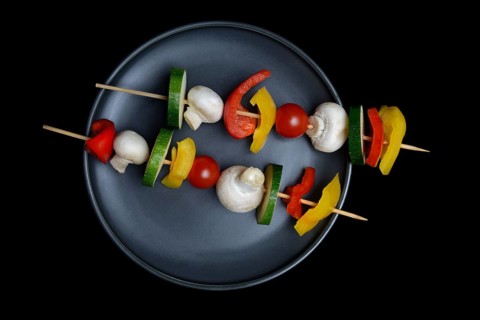 Colourful vegetable skewers on a plate, barbecue skewers