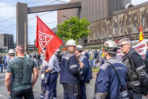 Steelworkers at a demonstration in front of the headquarters of ThyssenKrupp Steel Europe in