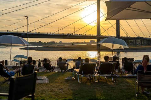 The city beach on the Rhine near Düsseldorf, riverside promenade, by the Rheinkniebrücke bridge,