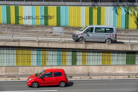 Motorway A40, Ruhrschnellweg, in the through road in Essen, noise barrier, with the slogan, life is