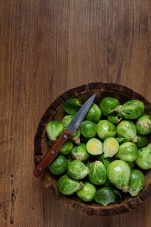 Fresh Brussels sprouts, raw, top view, on a wooden table, no people