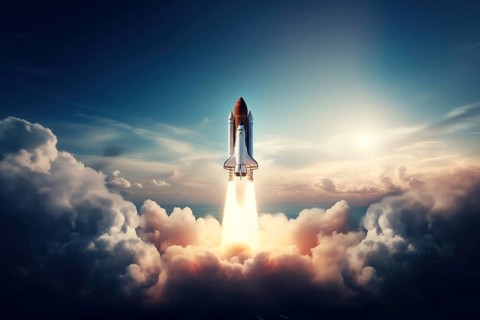 Aerial view of a rocket shuttle carrier launch at sunrise over an ocean coast. The rocket is