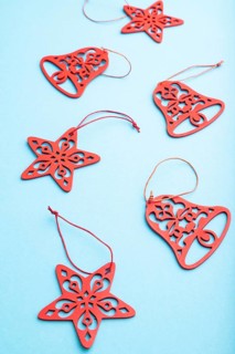 Christmas or New Year composition. Decorations on a blue pastel background. Side view, close up