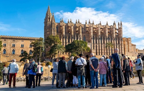 Palma de Majorca, Bay of Palma, the Cathedral of St Mary, group of tourists, from a cruise ship,
