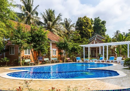 Swimming pool with blue water at the tropical hotel in Vietnam