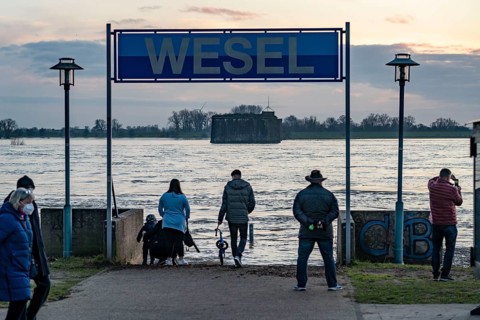 Rhine flood, riverside promenade in Wesel, the river water is already spilling onto the paths,