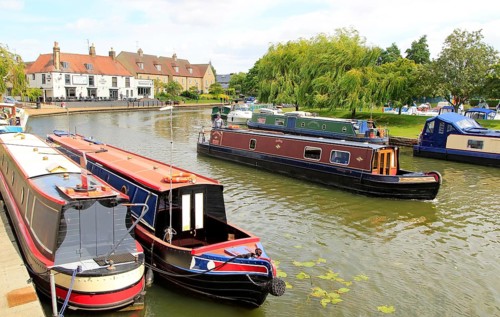 Narrow boats on the River Great Ouse, Ely, Cambridgeshire, England, UK
