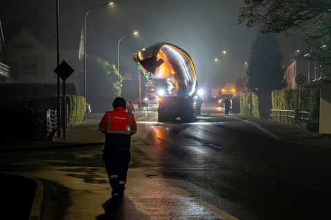Transport of a 68 metre long, 22 tonne blade of a wind turbine, here in Breckerfeld, with a