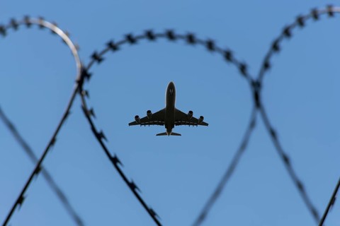 Symbolic image security, passenger aircraft taking off, security fence, Stuttgart Airport,
