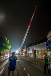 Transport of a 68 metre long, 22 tonne blade of a wind turbine, here in Breckerfeld, with a