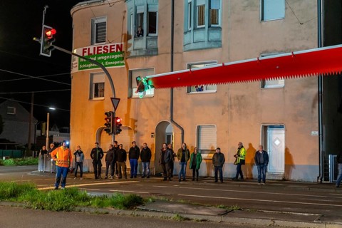 Transport of a 68 metre long, 22 tonne blade of a wind turbine, here in Schwelm, onlookers, with a