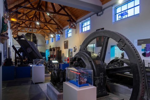 Vintage dynamo and old machines in the Industrial Museum at the Le Bois du Cazier coal mine,