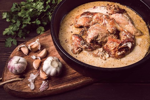 Shkmeruli, fried chicken, in milk-garlic sauce, Georgian cuisine, homemade, close-up, no people
