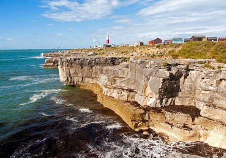 Red and white lighthouse on the coast at Portland Bill, isle of Portland, Dorset, England, United
