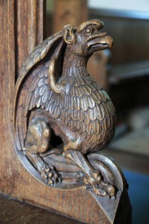 Carved wooden pew end figure, Huntingfield church, Suffolk, England, UK