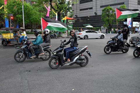 Motorcyclists with Palestine flags