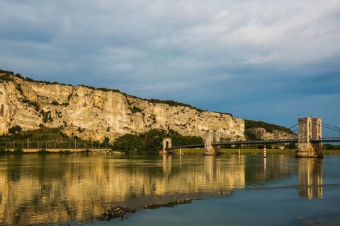 Old suspension bridge over the Rhone and rocks, Passerelle Marc Seguin, Tain-l'Hermitage,