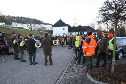 Hunters and hunting assistants, so-called beaters, in front of the start of the hunt, address by