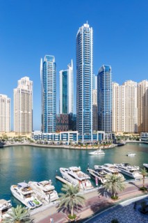 Dubai Marina skyline skyscrapers with yachts skyscrapers living on the waterfront in Dubai, United