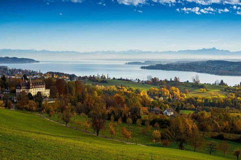View over Lake Constance in autumn, Spetzgart Castle in front, Alpine chain behind, near