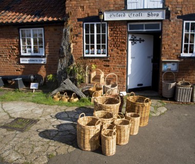Wicker baskets outside craft shop, Orford, Suffolk, England, United Kingdom, Europe
