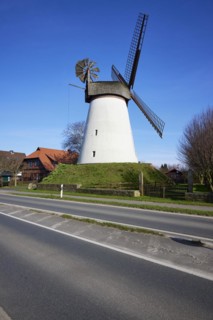 Windmill Hummelbecker Mühle under a cloudless blue sky, a Wall-Holländer, is part of the