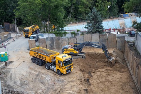 Construction work, excavating a building pit for a residential building
