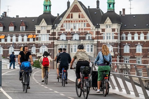 Cyclists on the Lille Langebro cycle and pedestrian bridge over the harbour, Copenhagen is