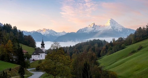 Maria Gern pilgrimage church at sunrise, behind Schönfeldspitze and the Watzmann, in autumn,