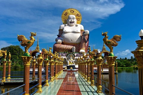 Laughing Buddha, larger-than-life statue in the Buddhist temple Wat Plai Laem, Koh Samui, Thailand,