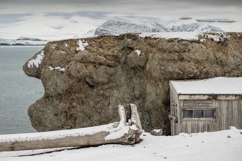 Driftwood and shed labelled County Jail, prison, Ny-Ålesund, Kongsfjord, Spitsbergen Island,