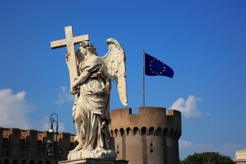 Statue of an angel with a cross on the Bridge of Angels over the Tiber, Rome, Italy, Europe