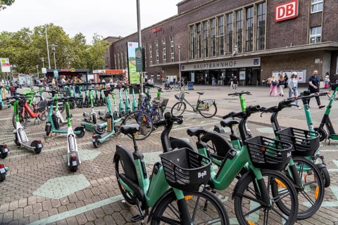 Designated sharing stations, parking space for e-scooters, rental bikes, e-scooters, in front of
