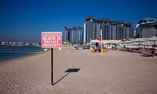 Private beach sign, NO TRESPASSING, BEACH IS PRIVATE PROPERTY, beach, parasols, Hotel NH Collection