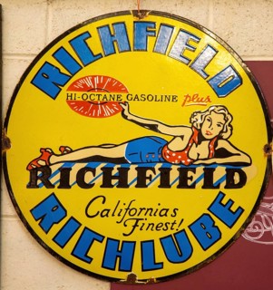Vintage metal sign for Richfield Hi-Octane gasoline, Richlube, from California, USA, blonde woman