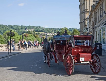 Horse drawn carriage tourist ride on Grand Parade, Bath, Somerset, England, United Kingdom, Europe